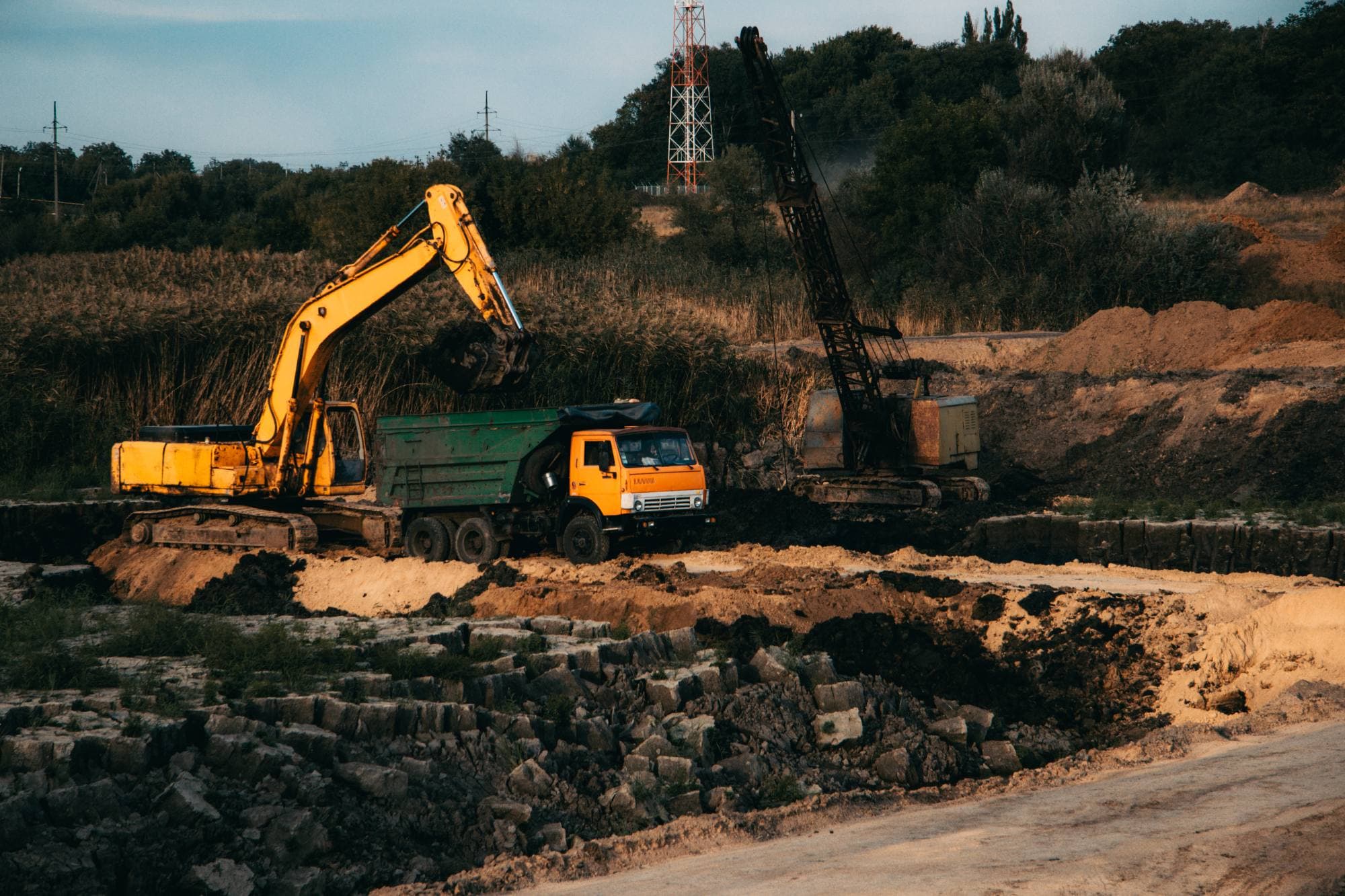 Excavator loading a haul truck